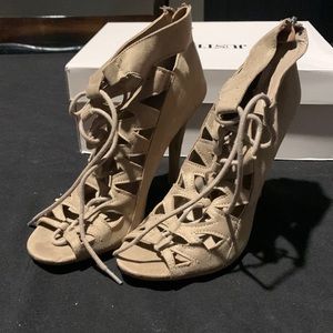 A khaki /tan colored lace up heel. Size 7. A Chinese Laundry Design
